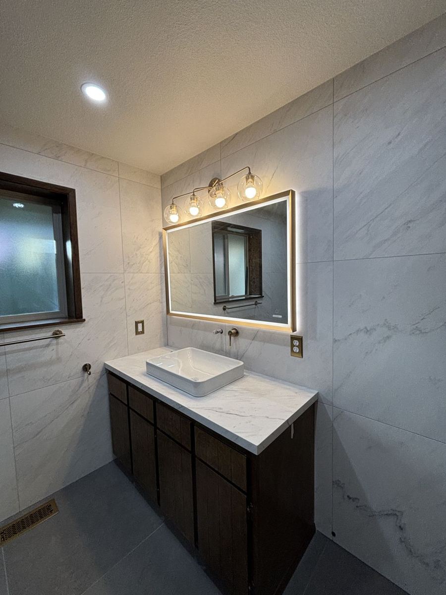 Vanity with vessel sink and large-format wall tile