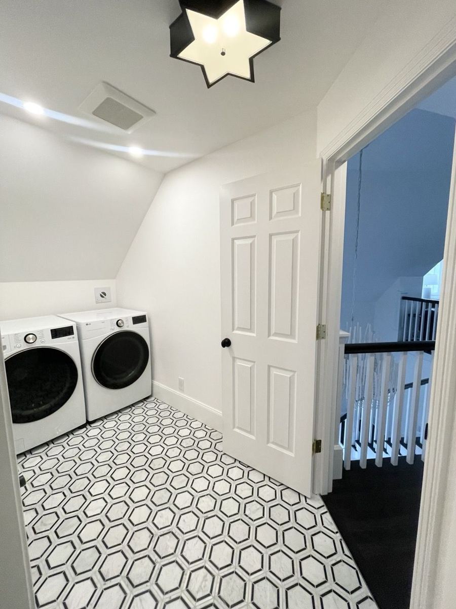 Hexagon mosaic tile floor in a bright laundry room