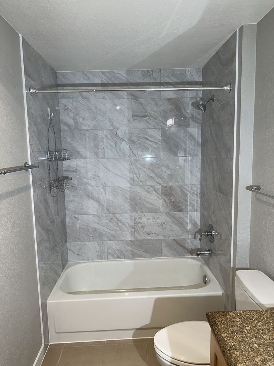 Tub with marble-look tile surround